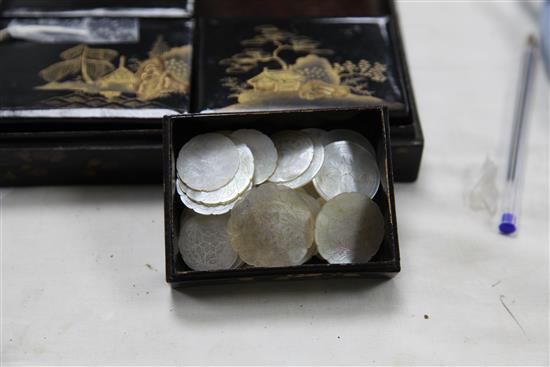 A collection of one hundred and fifty five mother of pearl gaming counters in a chinoiserie lacquered box, box. 8in.